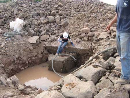 12-Superior Lake Stabilization, outlet pipe sealed by placing 3x3x3 gabion basket filled with rock and grout on upstream side of pipe